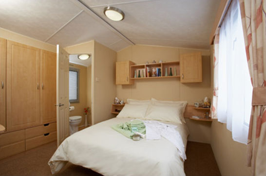 double bedroom in holiday caravan - trevaylor caravan and camping park